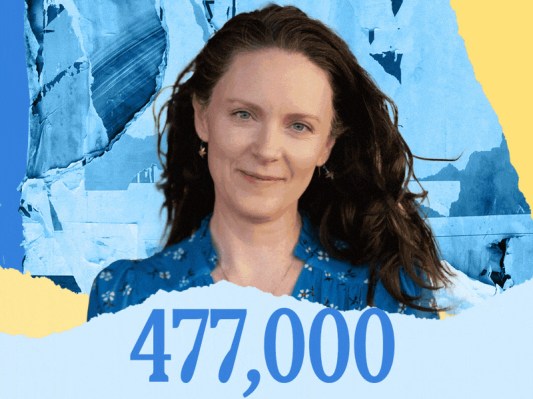 A woman stands against a blue and yellow background, with the number 477,000 prominently displayed nearby.