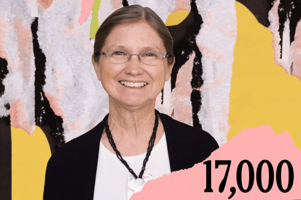 A woman wearing glasses and a black blazer with a white top stands against a vibrant, textured, colorful background with the number 17,000 prominently displayed.
