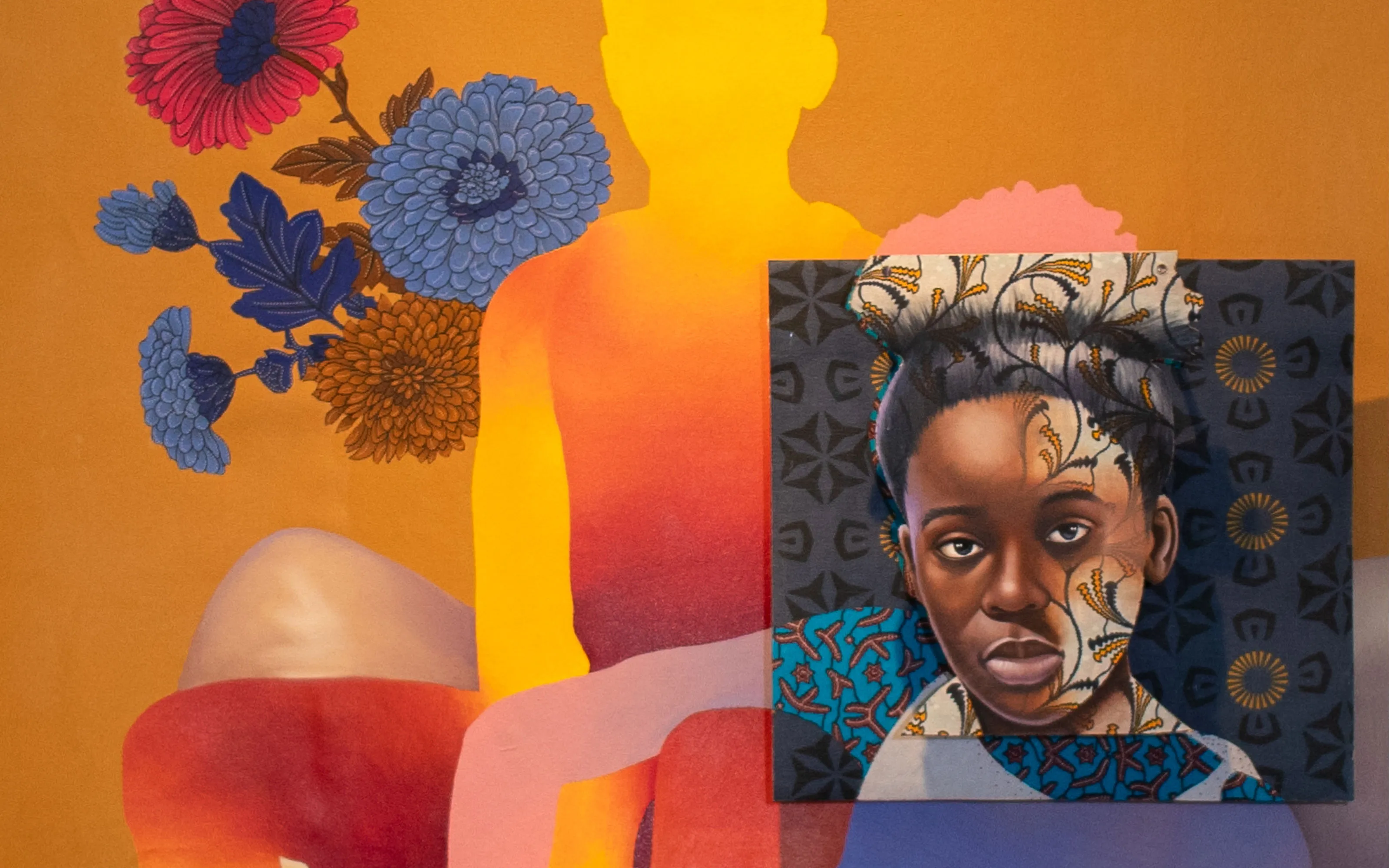 A vibrant artwork shows a portrait of a Black woman layered with patterns on her head set over a painted silhouette of a seated figure, surrounded by colorful flowers on an orange, red, and yellow background.