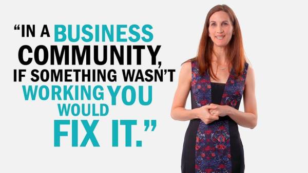 Elizabeth Swavola has long brown hair and is wearing a black dress with a blue and red-flowered pattern. Next to her is copy that reads, "In a business community, if something wasn't working you would fix it."